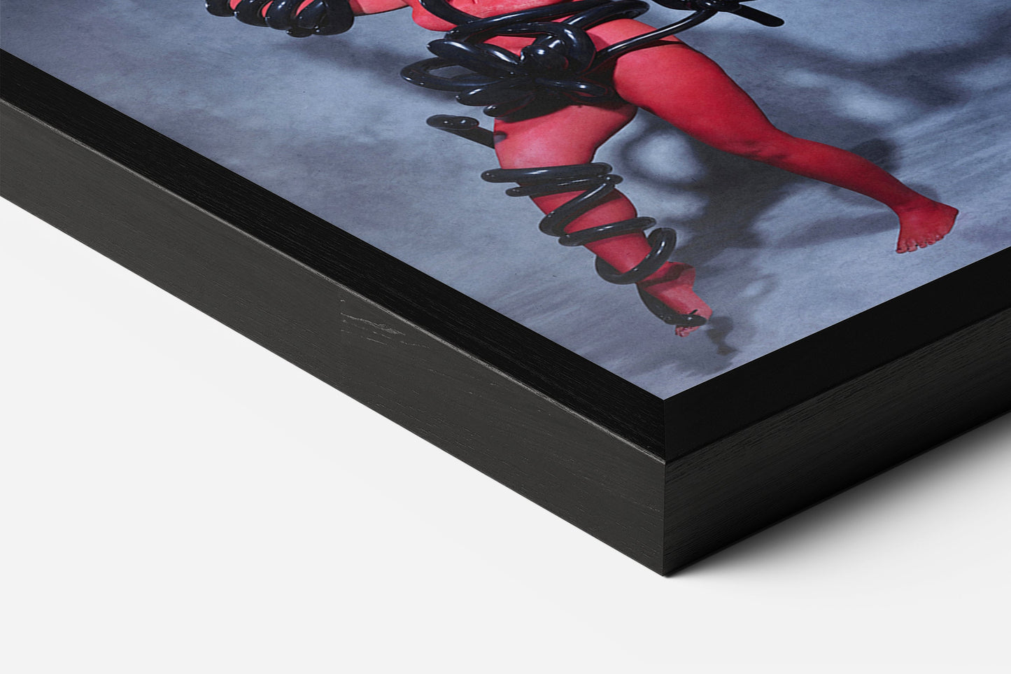 electrifying fine art print in black wooden frame, featuring a women painted in red with balloon art